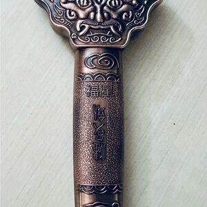 Intricate Bronze Key with Asian Motif